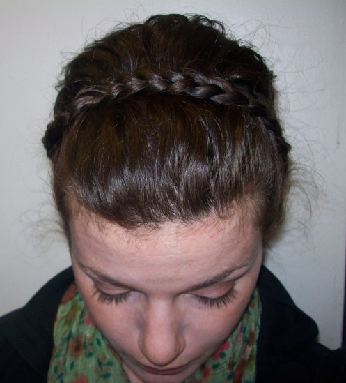 ...and you pull that plain, un-corn-rowed braid over the loose hair (the hair that a headband would normally push back).